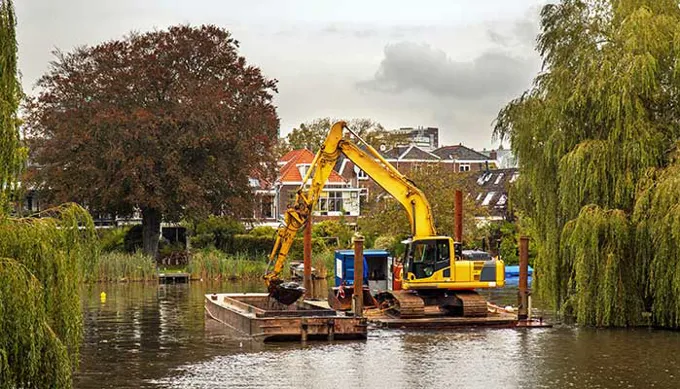 Dredging An Inland Canal By Crane