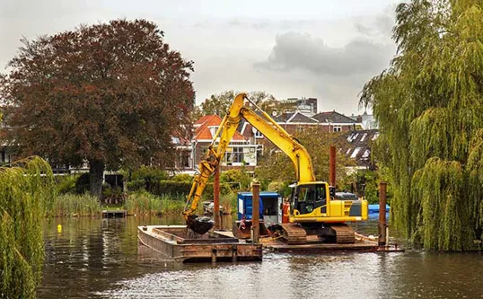 Dredging An Inland Canal By Crane