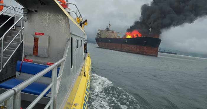 burning commercial ship